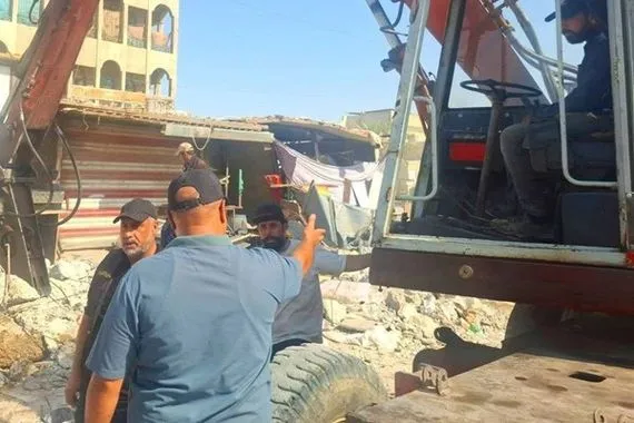 بالصور استمرار عمليات إزالة سوق مريدي في العاصمة بغداد