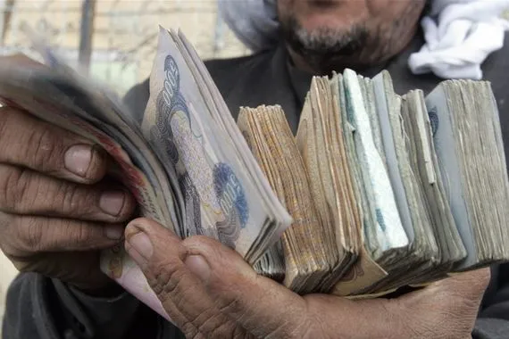 لماذا يرفض البنك المركزي العراقي خفض قيمة الدينار المرسومي يجيب بـ13 نقطة